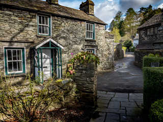 Grasmere, Cumbria, England. Traditional slate cottages in the English Lake District town of...