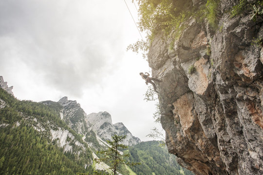 Landscape of Gosau Valley mountain with a male climber