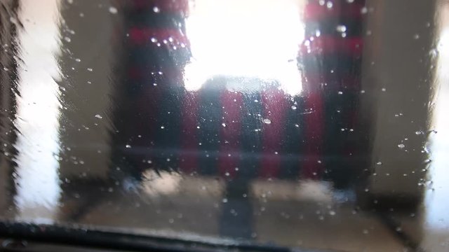 View from car at automatic car wash. Inside view from car. 