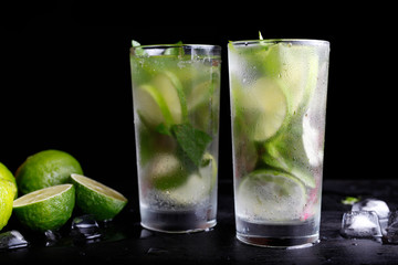 Mojito traditional summer vacation refreshing cocktail alcohol drink in highball glass