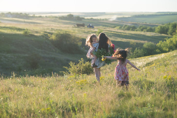 dancing happy family at summertime