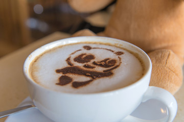 latte art coffee or cappuccino on wooden table background