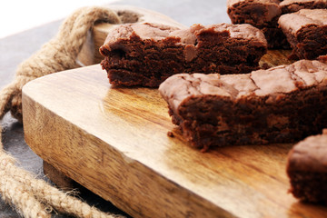 Brownie stack, chocolate cake on rustic wooden board