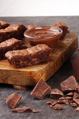 Brownie stack, chocolate cake on rustic wooden board