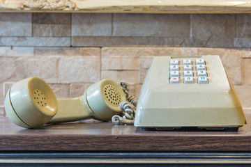 retro telephone on wooden table, vintage style