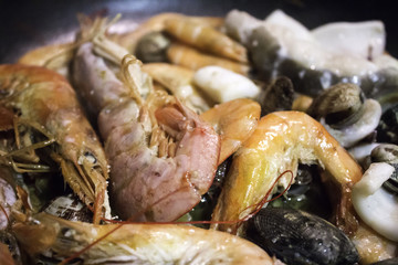 Preparing seafood for paella