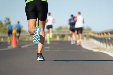 Fototapeta premium Marathon running race, people feet on road