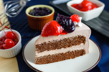closeup delicious fresh dessert strawberry cherry blueberry fruit with  white cream slice cake