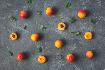 Apricot on black background. Sliced apricot top view, flat lay