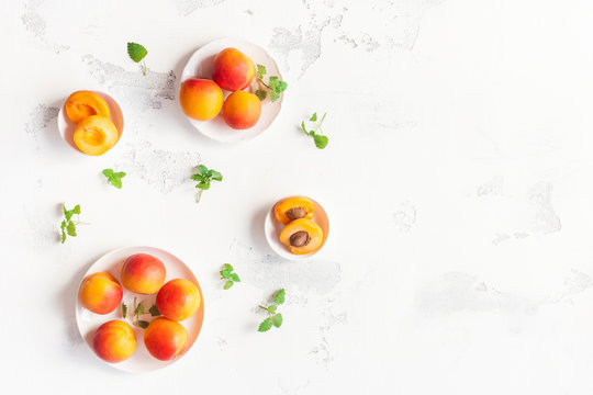Apricot on white background. Sliced apricot top view, flat lay, copy space