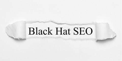 Black Hat SEO on white torn paper