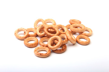 Salty Mini Pretzels with Salt in a Bowl, small bagel - homemade organic snack for beer isolated white background