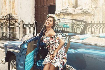 Beautiful woman and retro car