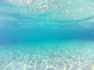Underwater background. Blue sea water - obrazy, fototapety, plakaty
