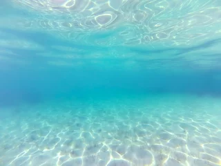Fotobehang Underwater background. Blue sea water © Crazy nook