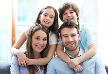 Family relaxing on sofa
