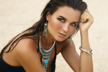 Fototapeta premium Woman wearing silver jewelry on the beach