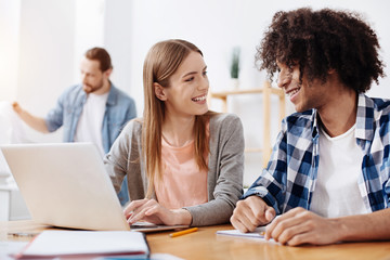 Outgoing energetic colleagues having a pleasant chat