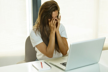 Tired woman in office