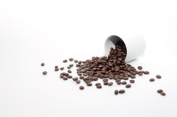 coffee beans and white coffee cup on white background