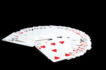 Playing cards isolated on black.