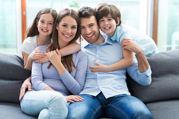 Family relaxing on sofa
