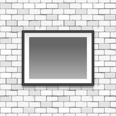 Gallery interior with empty black frame on gray old brick wall with cracks. Can be used as mock up. blank canvas in the frame