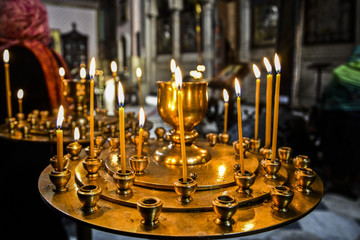 Fototapeta na wymiar Candles in orthodox church in georgia.