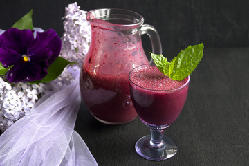 Healthy delicious smoothie of blueberries. on a black background.