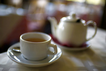 Kettle and a cup on the table