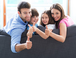 Fototapeta premium Family relaxing on sofa 