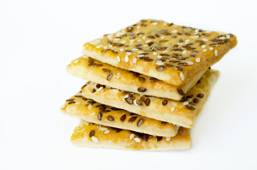 Grain cookies stacked on a white background