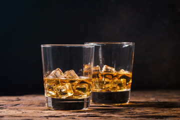 Whiskey with ice in glasses