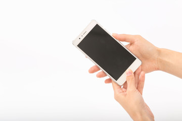 Female hands on a white background with a phone.