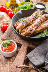 Grilled sausages with sauce