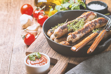 Grilled sausages with sauce