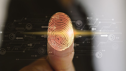 Businessman login with fingerprint scanning technology. fingerprint to identify personal, security system concept - obrazy, fototapety, plakaty