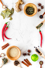 Cooking with spices, salt and pepper on kitchen table background top view mock-up