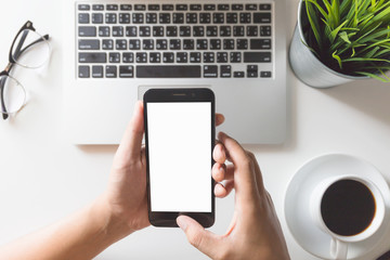 Man hands on smartphone on desk / blank screen