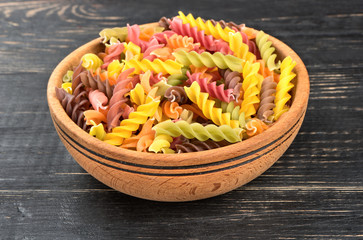 Colorful fusilli pasta in bowl