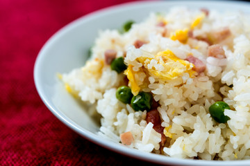 Homemade Chinese fried rice with vegetables and fried eggs