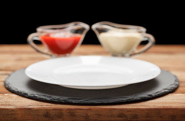 Empty plate and condiments