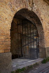 Fototapeta na wymiar Arched passage in the fortress. Fragment of the fortification of the nineteenth century The Kiev Fortress