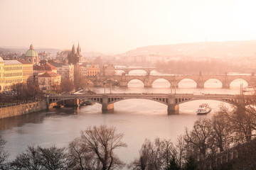 Fototapeta na wymiar Prague bridges over Vltava river at sunset time, Czech Republic.