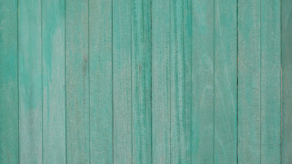 Wooden old fence, green background