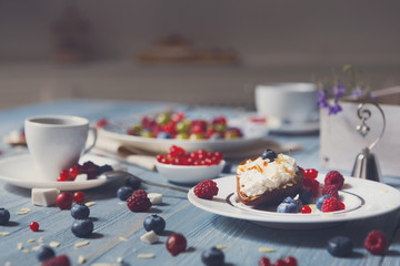 Breakfast with baked pea and berries at blue rustic wood