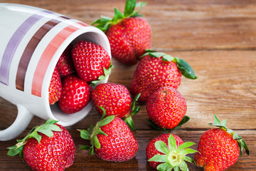 Fresh ripe strawberries in mug