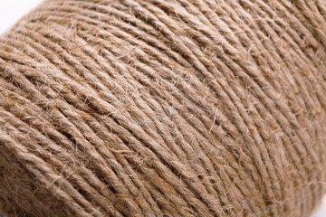 Coil of natural rope on white background