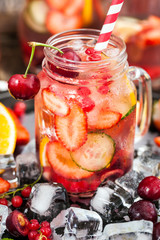Healthy infused detox water with fresh berries and fruits
