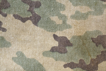 Dirty old camouflage uniform pattern. © pavelalexeev